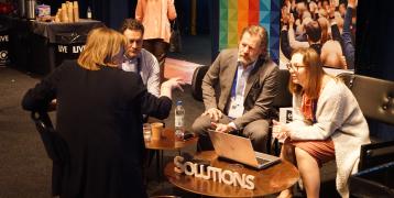 People discussing around a table